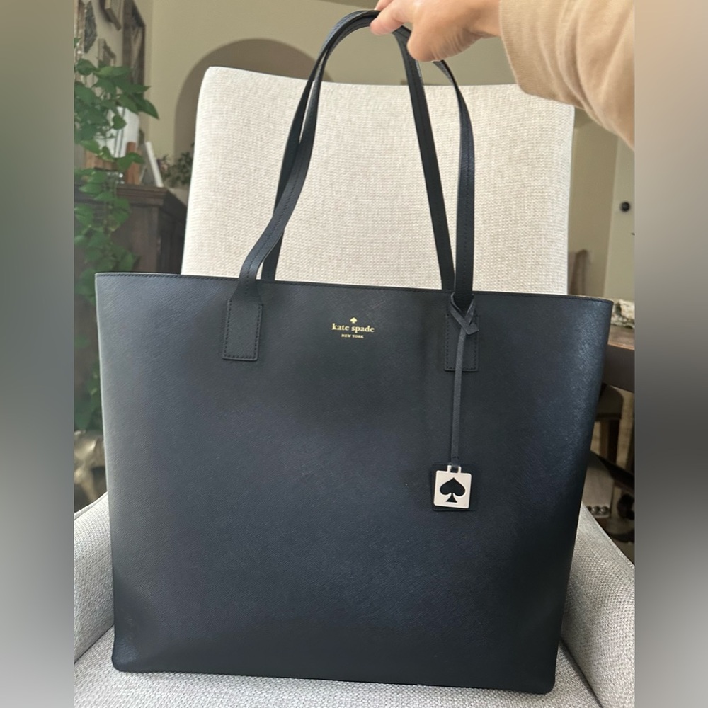 Black Kate Spade Tote, with Spade Charm Attached.